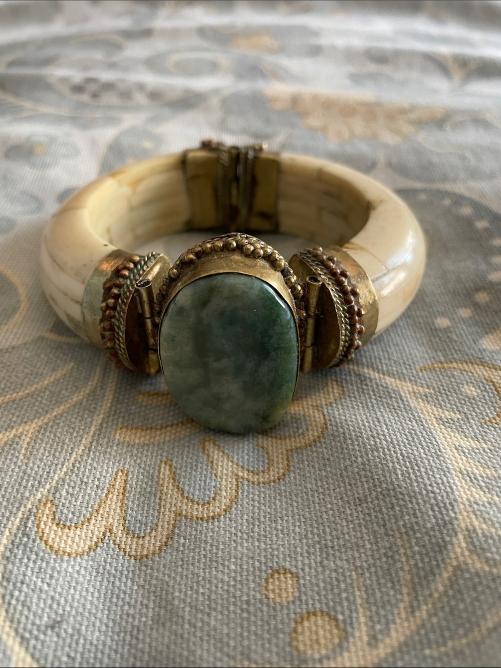 Cream Bangle Bracelet with Green Stone and Gold Accents